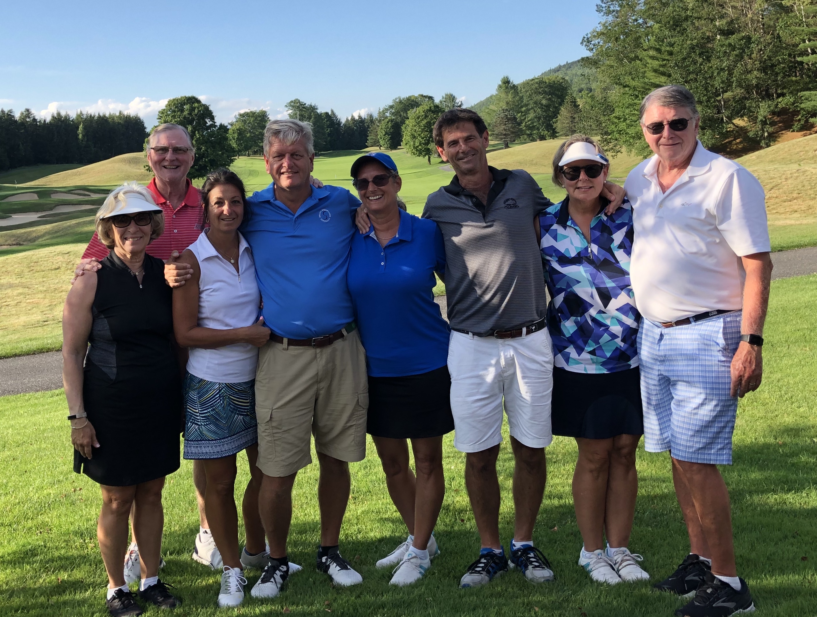 Group of Wild Dunes golf members posing on the fairway