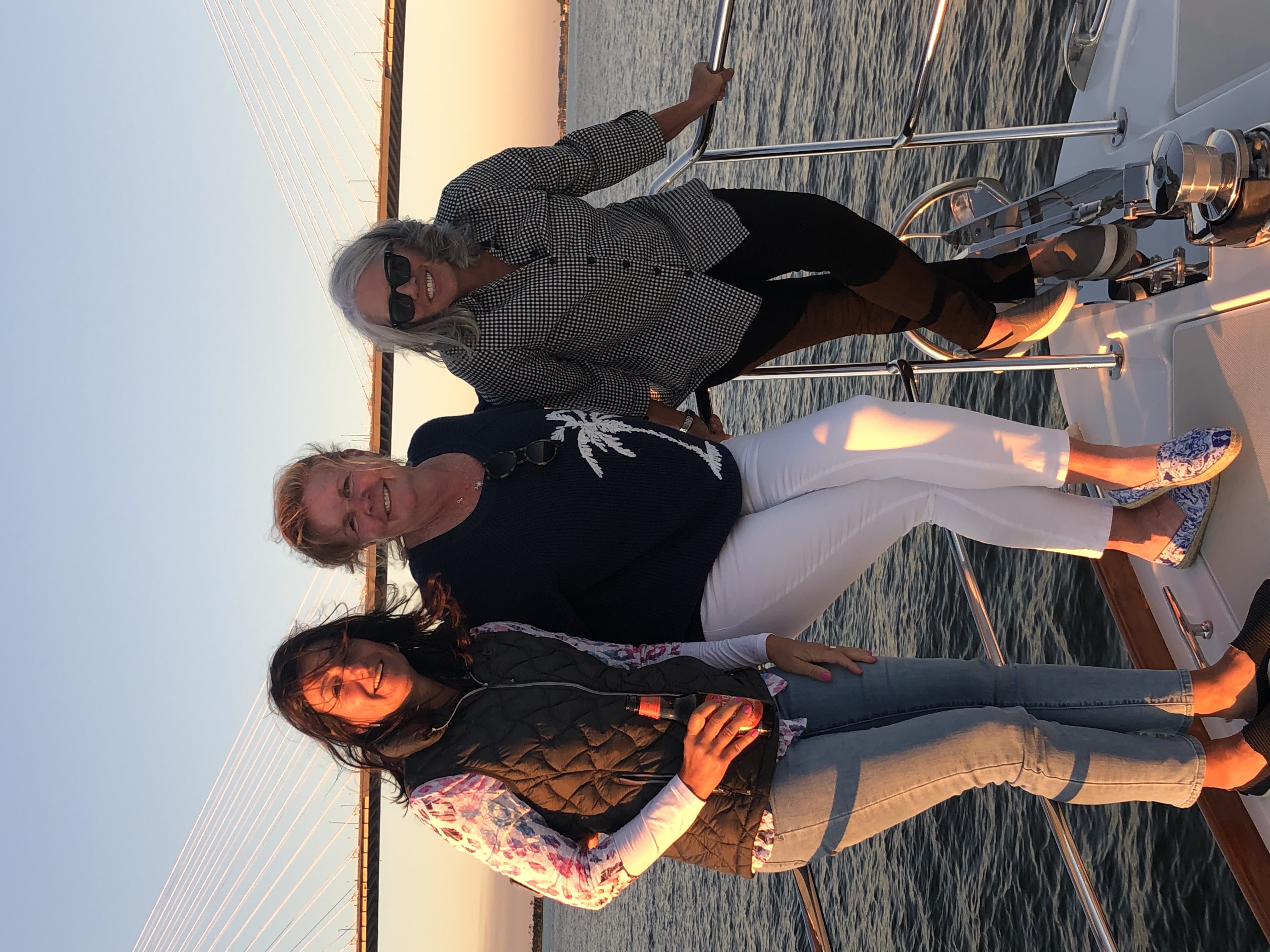 Members enjoying a sunset on the water