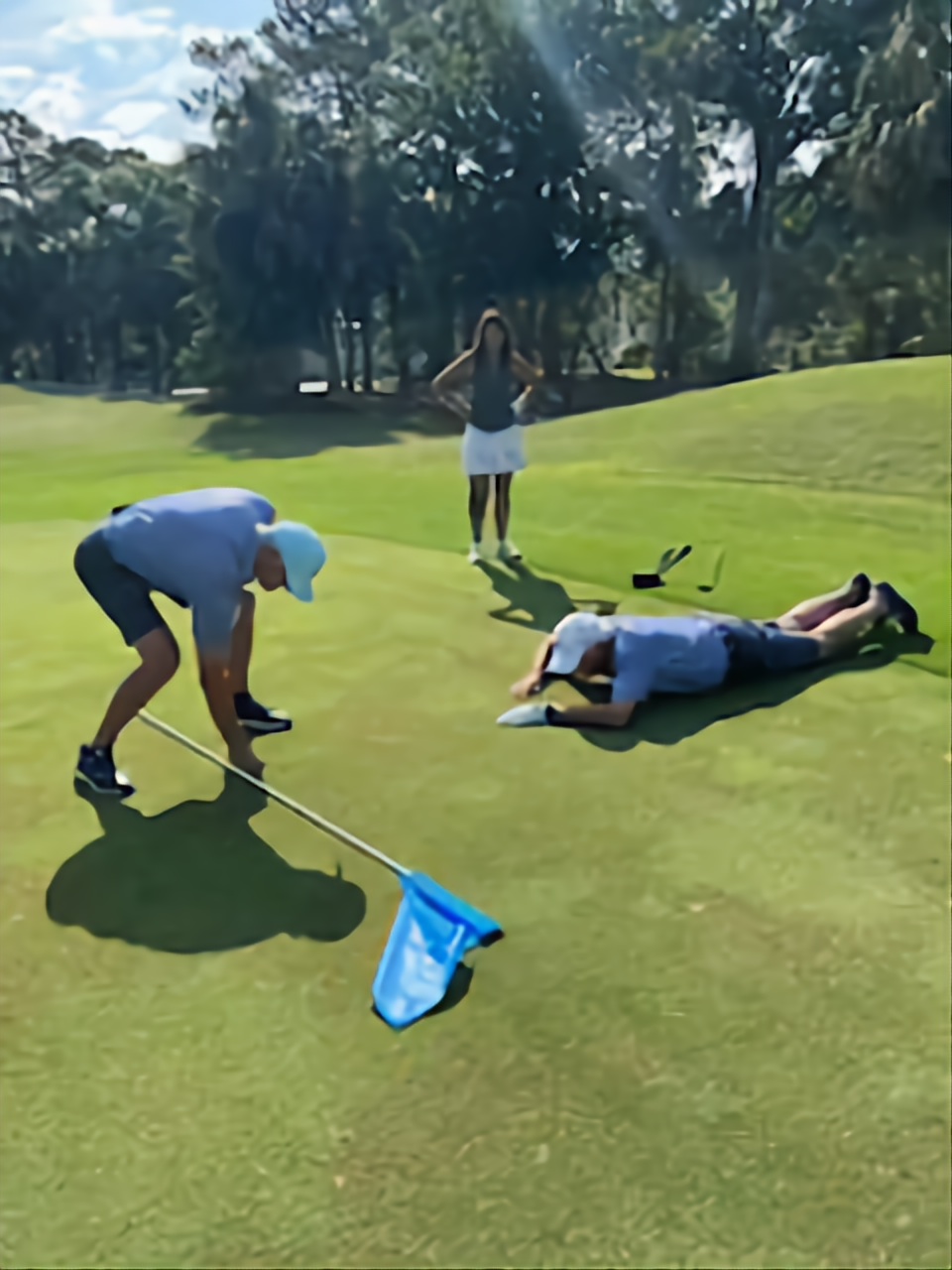 Members lining up a putt on the green at Wild Dunes